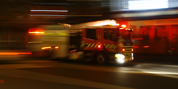 A large building which contained a number of vehicles was destroyed in the fire. Photo / File