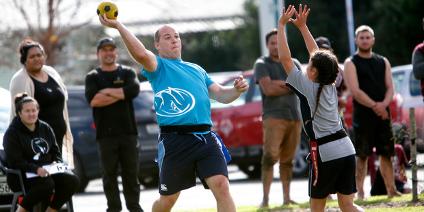 Northland Taniwha Team member Tim Dow goes for the long pass over Kyra Manahi, 12, from Huanui College.