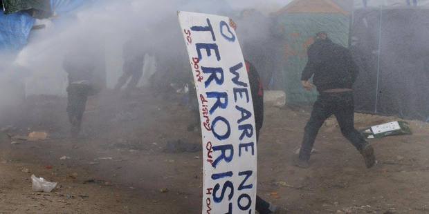 People run from the teargas used by police to suppress protests. Photo / Facebook