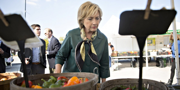 Hillary Clinton views a selection of peppers at a farmers market in Davenport, Iowa, last October. Photo / Daniel Acker, Bloomberg