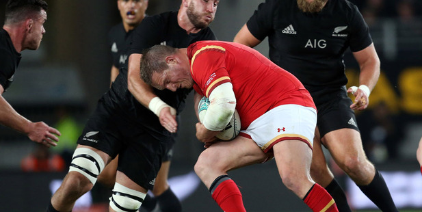 Luke Romano (L) tussles with Wales' Gethin Jenkins (R) during the rugby Test match between the All Blacks and Wales. Photo / Getty