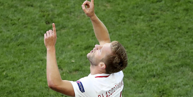 Poland's Jakub Blaszczykowski celebrates after scoring the opening goal against Ukraine. photo / Ap