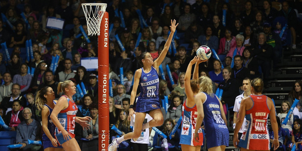Mystics defender Anna Harrison attempts to block a shot from the Swifts. Photo / Doug Sherring