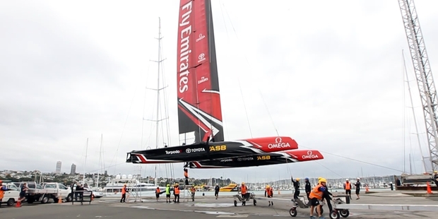 Emirates Team New Zealand launch the first of their America's Cup test boats at their new base in Auckland. Photo / Michael Craig