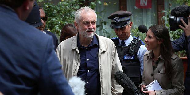 Labour Party leader Jeremy Corbyn faces the media as he leaves his house in London. Photo / AP