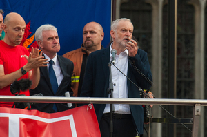 Labour leader Jeremy Corbyn, right, speaks in Parliament Square, London. Photo / AP