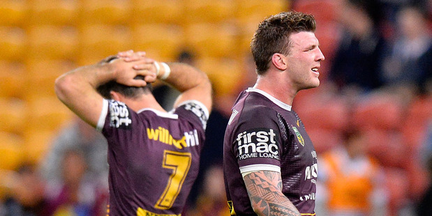 Ben Hunt and Josh McGuire of the Broncos are dejected after their team loses the round 17 NRL match. Photo / Getty Images.