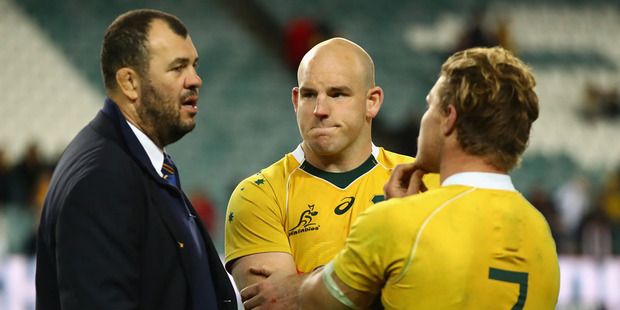 Wallabies coach Michael Cheika, captain Stephen Moore and Michael Hooper of the Wallabies talk after losing. Photo / Getty Images.