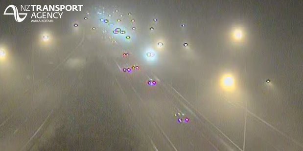 Motorists were warned to take care as fog blanketed the motorway this morning. Photo / NZTA