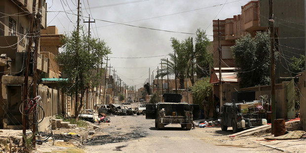 Iraqi Prime Minister Haider al-Abadi urged all Iraqis to celebrate the recapture of Fallujah by the security forces and vowed the national flag would be raised in Mosul soon. Photo / AP