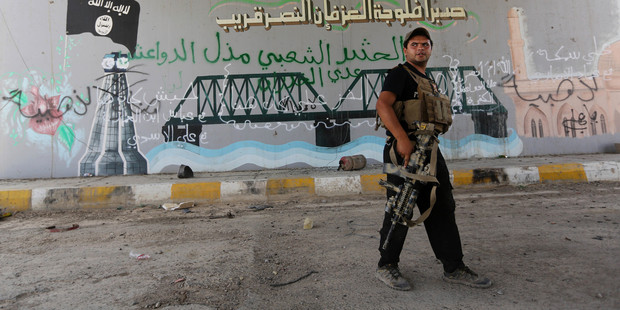 A member with Iraqi counter-terrorism forces patrols Fallujah, Iraq. Photo / AP