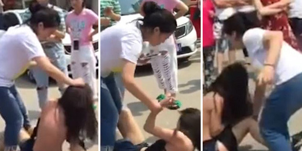A woman cowers as she is attacked by a group who believe she is having an affair with one of their husbands. Photos / YouTube