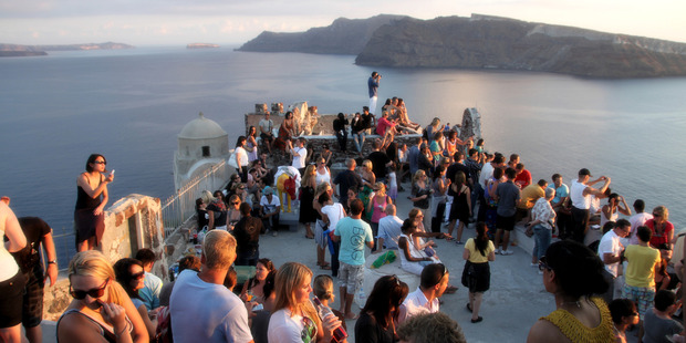 Santorini in Greece is one of many cities worldwide that is restricting tourism numbers to protect its local environment and culture. Photo / Flickr