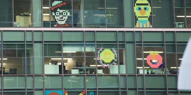 Post-it note declaration of war. The colourful challenge going on between the Zurich Building and HSBC House in downtown Auckland. Photo / Nick Reed