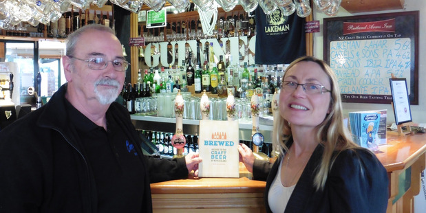BEER AND BOOKS: Peter Northway from SOBA and Gillian Tasker from the Whanganui Literary Festival Trust.