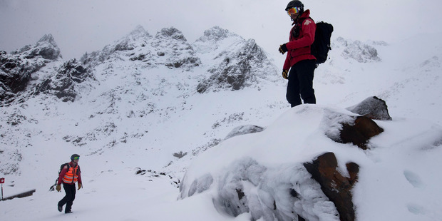 Ski Patrol members on the upper slopes of Whakapapa Ski Area on Mt Ruapehu. Photo / Alan Gibson