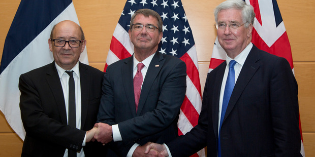 US Defence Secretary Ash Carter (centre) with British Defence Minister Michael Fallon (right) and French Defence Minister Jean-Yves Le Drian at Nato headquarters in Brussels on June 14. Photo / AP