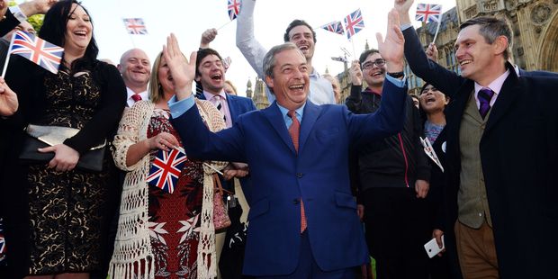 Nigel Farage, the leader of the UK Independence Party celebrates with his supporters in London as people voted to leave. Photo / AP