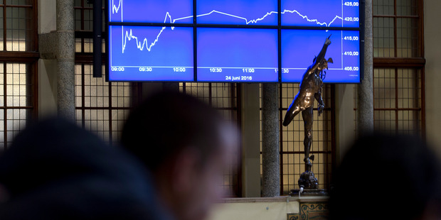 Visitors look at a graph showing the sharp fall of the AEX index following the British Brexit vote at the Euronext Amsterdam Stock Exchange, Netherlands.