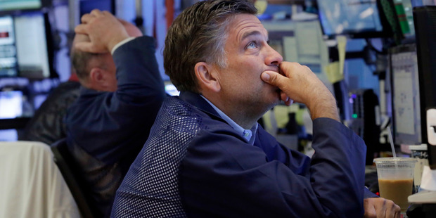 Trader Jeffrey Lucchesi works on the floor of the New York Stock Exchange. File photo / AP