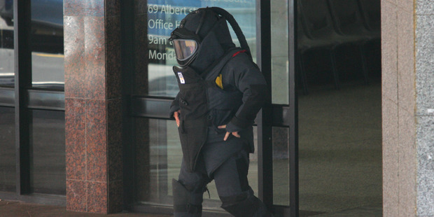 A member of the Army bomb squad. Police cordoned off Nicol Jewellers, where the bomb was found, and evacuated the two shops on either side. Photo / Brett Phibbs