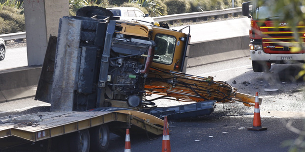 The digger hit the Southern Motorway overbridge last month. Photo / Nick Reed