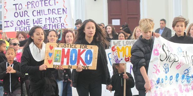 Jayde Rikiti (left), Kowhai Hohaia, Lachlan Blathwayt and Jonty Spicer in Masterton join crowds pleading for an end to violence against children. Photo / NZME