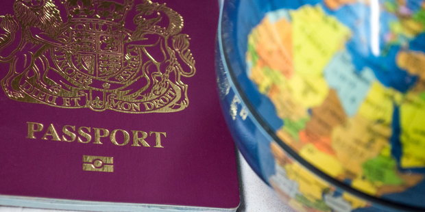 The video shows the walking down the street waving his British passport. Photo / iStock