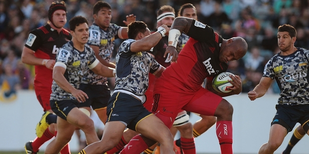 Nemani Nadolo (centre, at left) and his fellow Crusaders will be exceptionally hard to catch if they win against the Chiefs tonight in Suva. Photo / Getty Images