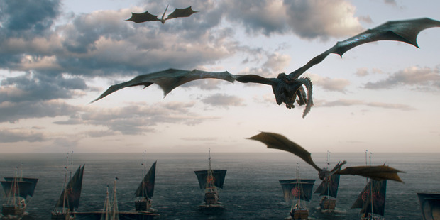 Daenerys' dragons fly above her fleet of ships headed for Westeros.