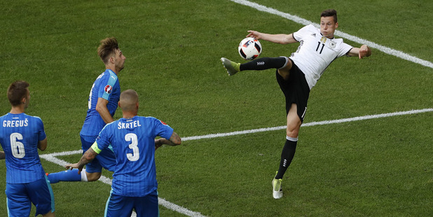 Germany's Julian Draxler scores his side's third goal against Slovakia. Photo / AP