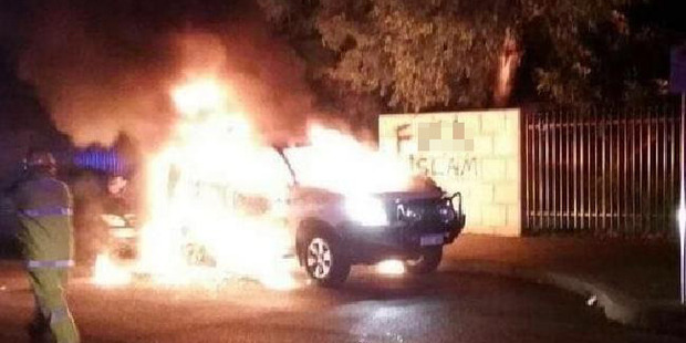 Worshippers found the burning 4WD after hearing a loud bang. Anti-Islam graffiti was sprayed on the mosque's walls. Photo / AP
