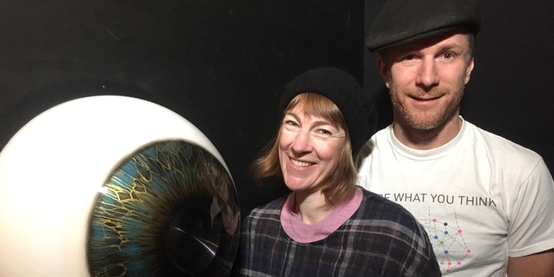 Armagan Ballantyne (left) and Jon Baxter with the giant eye installation at Motat as part of the new exhibition. Photo / Supplied
