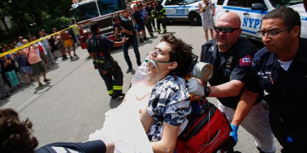 A critically injured man lies on a stretcher after an explosion at Central Park in New York. Photo / AFP
