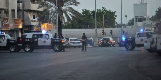Saudi policemen stand guard at the site where a suicide bomber blew himself near the American consulate in the Red Sea city of Jeddah. Photo / AFP