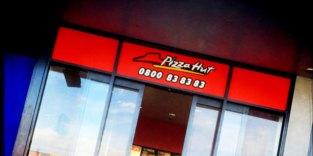 Steve catches an episode of Dr Phil while dining at Pizza Hut on Lincoln Road. Photo / Michael Craig