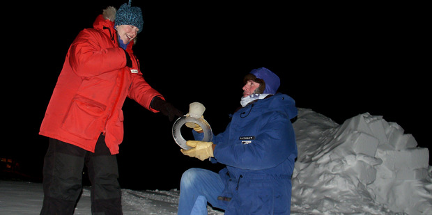 Anthony on his knees with an engagement ring appropriate to the occasion. Photo / Anthony Powell © Antarctica New Zealand Pictorial Collection, 2015-2016