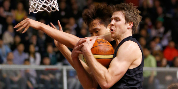Tom Abercrombie collects the rebound against South Korea. Photo / Getty Images