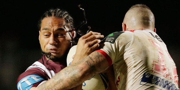 Martin Taupau of the Sea Eagles is tackled by Joel Thompson of the Dragons. Photo / Getty Images.