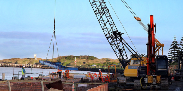 WATERFRONT UPGRADE: Contractors set steelwork in place at the No 1 wharf at Whanganui's port.
PHOTO/STUART MUNRO
