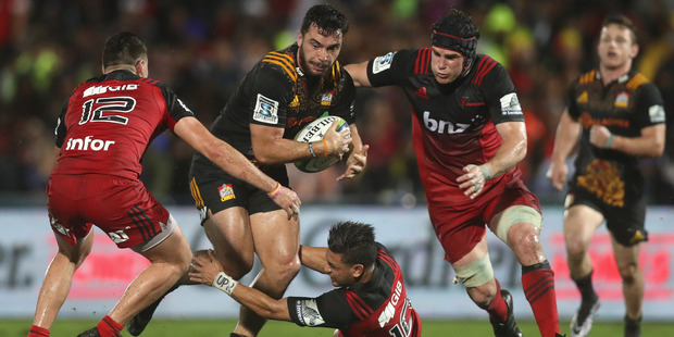 Chiefs winger James Lowe takes on the Crusaders' defence in Suva last Friday. Photo / Getty Images