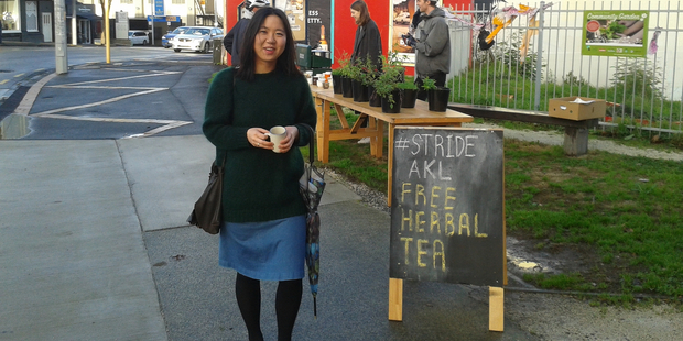 Soojeong Lee on the way to work with a cup of herbal tea at the corner of New North Rd and Symonds St. Photo / Supplied