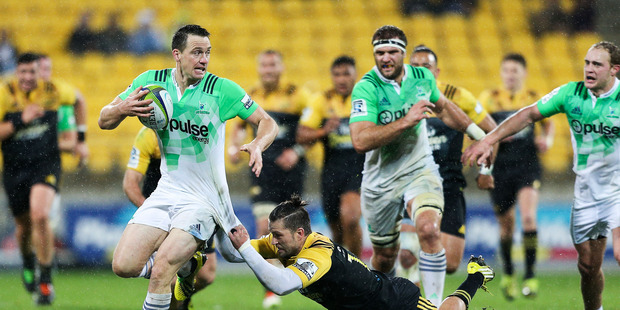 Ben Smith of the Highlanders is tackled by Cory Jane of the Hurricanes during the round 14 Super Rugby match between the Hurricanes and the Highlanders. Photo / Getty Images.