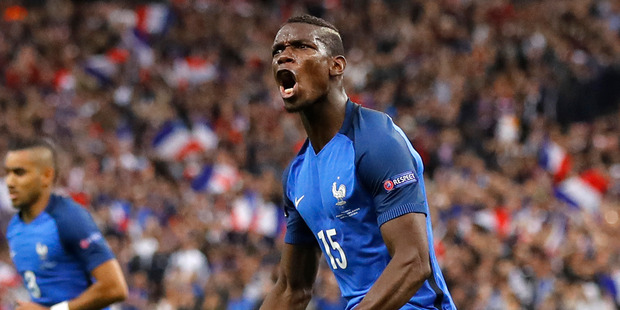 France's Paul Pogba celebrates after scoring his side's second goal during the Euro 2016 quarterfinal soccer match between France and Iceland. Photo / AP.