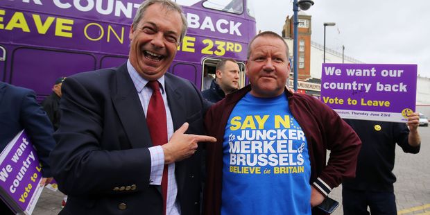 Ukip leader Nigel Farage, left, poses with local Ramsgate taxi driver Chris Bissett during his party's referendum bus tour. Could NZ be next in the push to say 'up yours' ? Photo / AP