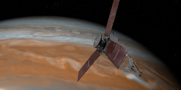 This artist's rendering shows the Juno spacecraft above Jupiter. Photo / AP