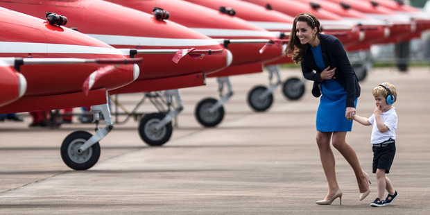 Prince George, right, with his mother Kate, the Duchess of Cambridge. Photo / AP