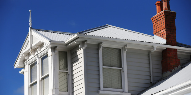 Prime Minister John Key told the central bank to "just get on with it" and introduce immediate restrictions on rampant property investors. Photo / Doug Sherring