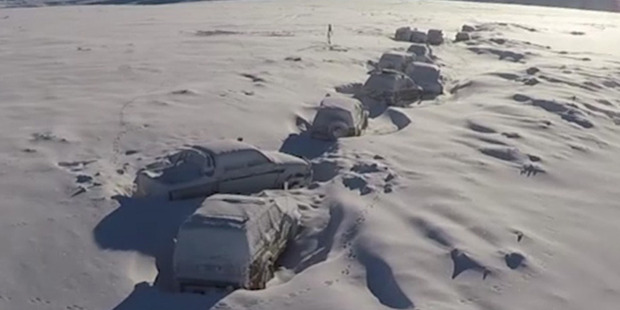 A helicopter view of the abandoned four-wheel-drive vehicles on the Waikai Bush track in Central Otago, before the owners recovered them. Photo / Heliview