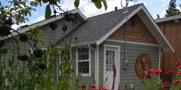 This urban 1/4-acre mini-farm hosts up to four guests in a two-bedroom cottage. Photo / Airbnb